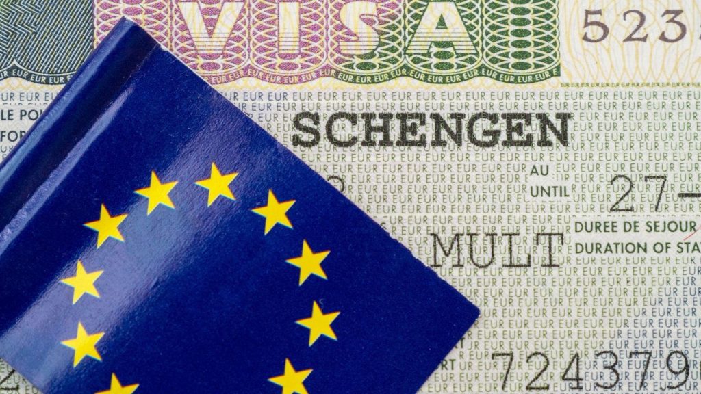 An image of an EU flag on a Schengen visa
